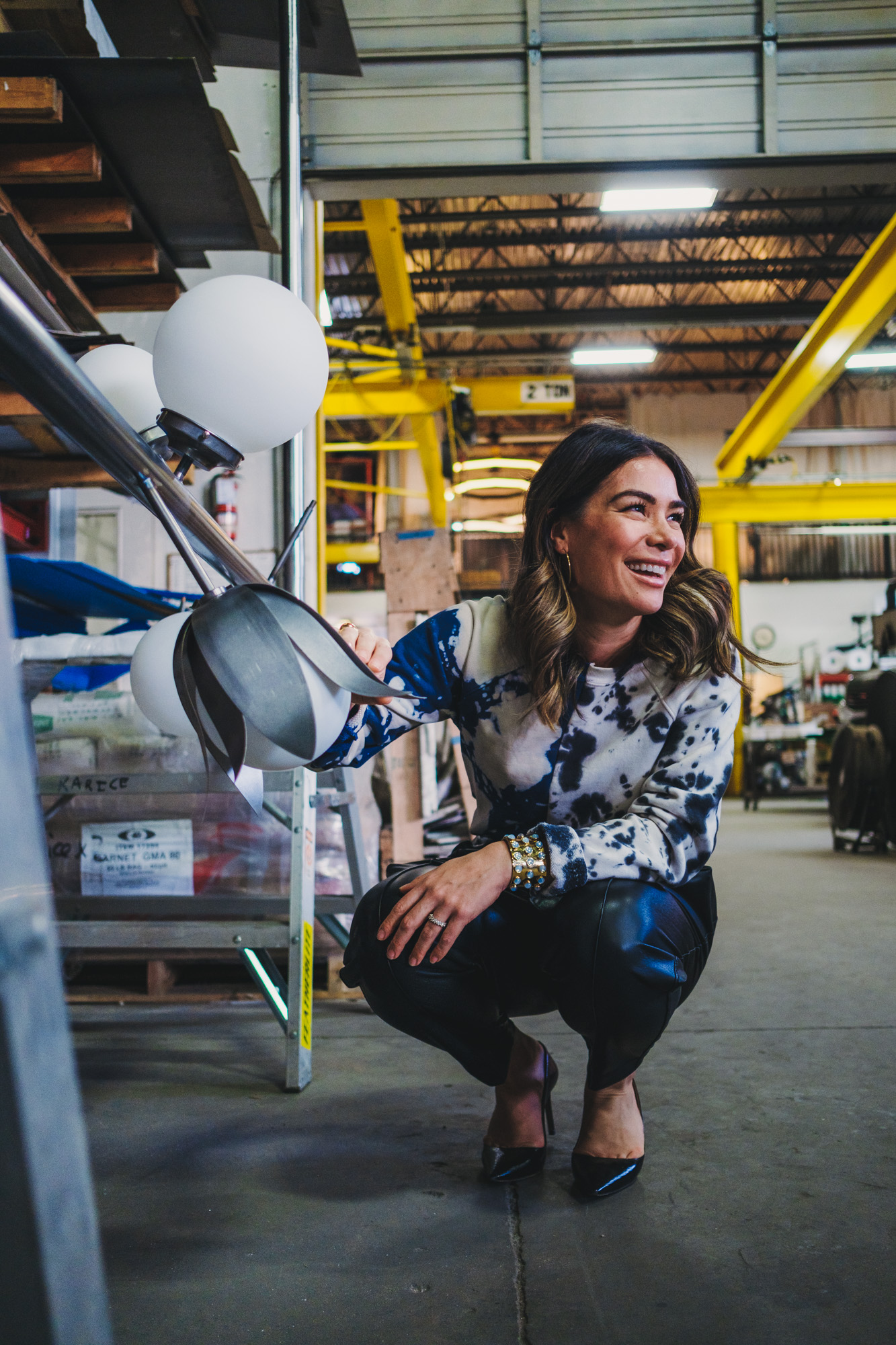 Karin Bohn looking at custom lighting in construction, tulip designed light fixture