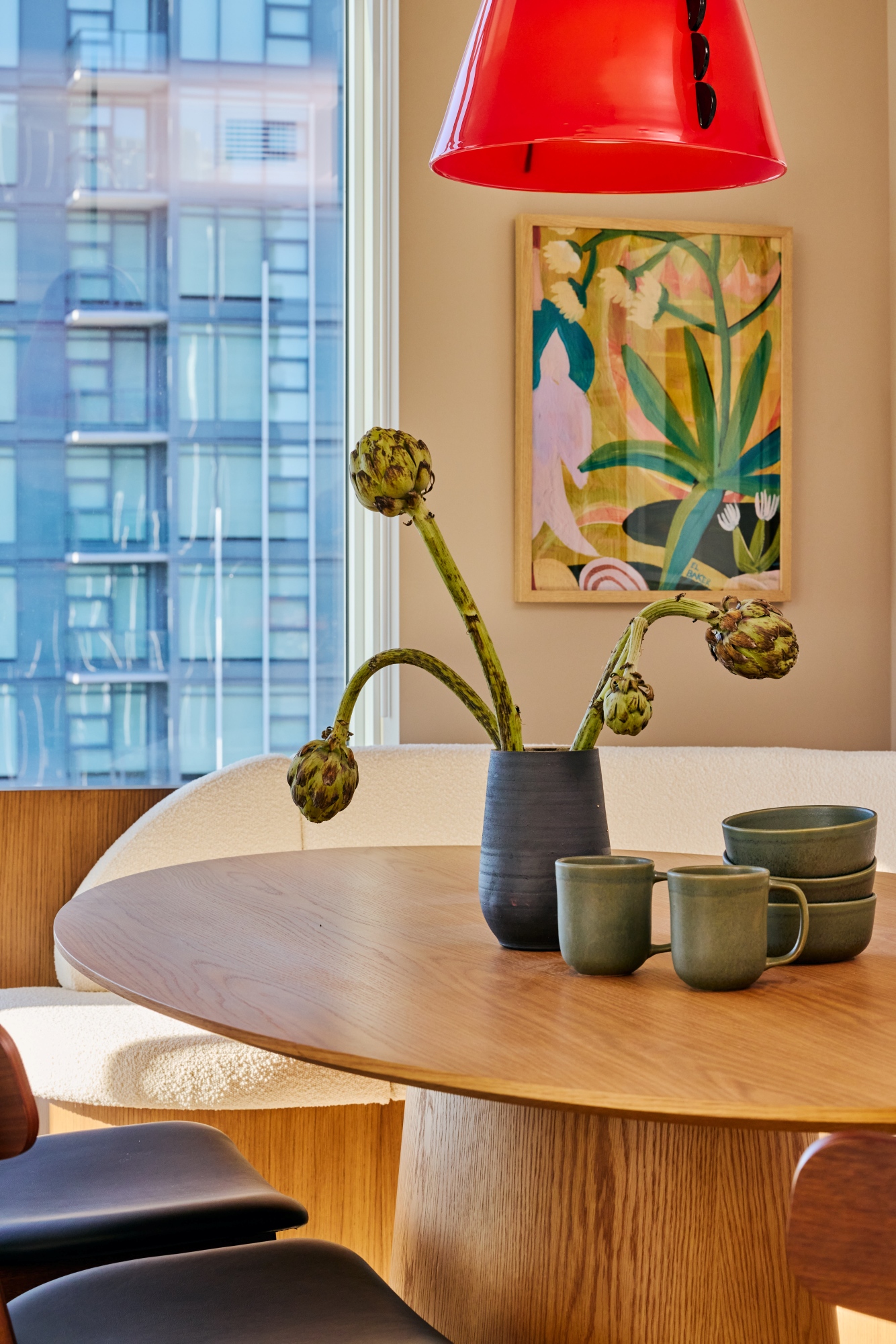 Dining table setting with mugs and bowls.